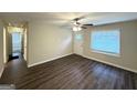 Bright living room with a ceiling fan, modern flooring, and ample natural light at 70 Macon Se Pl, Atlanta, GA 30354