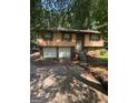 Charming split-level home with two-car garage and mature trees at 2101 Newgate, Decatur, GA 30035