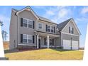 Charming two-story home with a well-maintained lawn, featuring a gray facade and attached two-car garage at 469 Ralph Still, Dacula, GA 30019
