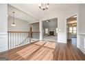 Open-concept living space with hardwood floors, neutral walls, and bright natural light at 6005 Crowley Dr, Douglasville, GA 30135