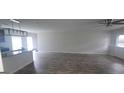Open-concept living room with hardwood flooring, seamlessly connected to the modern kitchen at 3484 Enterkin Ln, South Fulton, GA 30349