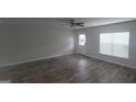 Spacious living room featuring hardwood floors, neutral walls, and plenty of natural light at 3484 Enterkin Ln, South Fulton, GA 30349