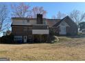 Exterior home view featuring a garage, a mix of brick and siding, plus a sunroom with great natural light at 291 Morgan Mill Rd, Brooks, GA 30205