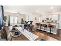 Open dining area with a stylish table set, seamlessly connecting to the modern kitchen at 12167 Conrad Cir, Hampton, GA 30228