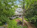 Charming two-story home with a sprawling porch and manicured lawn and garden at 53 Born St, Norcross, GA 30071