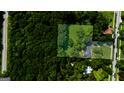 Aerial view of the property's layout, showcasing its landscaping, and surrounding greenery at 357 W Hightower Trl, Social Circle, GA 30025