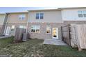 Backyard area with a small concrete patio and wooden fence at 1650 Larkspur Trl, Conyers, GA 30012