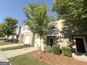 Well maintained townhomes with light colored brick and green landscaping at 1650 Larkspur Trl, Conyers, GA 30012