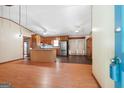 A open living room with wood floors and ceiling fan at 207 Conkle Rd, Hampton, GA 30228