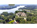 Beautiful home near Lake Horton, surrounded by a lush green landscape with mature trees and plenty of privacy at 285 Acton Dr, Fayetteville, GA 30215