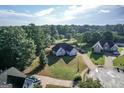 Expansive aerial view of a beautiful home, showcasing its large lot and wooded surroundings at 609 Alyssa Ct, Locust Grove, GA 30248