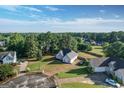 Aerial view showcasing the home's spacious lot and its location in a quiet, wooded neighborhood at 609 Alyssa Ct, Locust Grove, GA 30248
