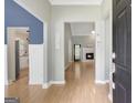 Inviting foyer features hardwood floors, gray walls and provides an entryway into the home at 70 N Strathmore Dr, Sharpsburg, GA 30277