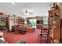 Spacious living room featuring classic decor, including a ceiling fan and plush seating at 292 Selfridge Rd, Mcdonough, GA 30252