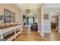 Open-concept living space with views to the fireplace, kitchen, and dining areas at 403 Chester Piper Rd, Covington, GA 30014