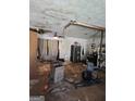 Spacious unfinished basement with ceiling damage, offering potential for renovation and customization at 8778 Homewood Ct, Riverdale, GA 30274