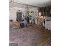 Unfinished basement featuring exposed utilities, appliances, and a blank canvas ready for customization at 8778 Homewood Ct, Riverdale, GA 30274