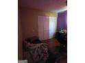 Cozy bedroom with closet, featuring neutral walls and desk space at 8778 Homewood Ct, Riverdale, GA 30274