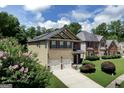 Attractive home with two-car garage, well-manicured landscaping, and inviting curb appeal at 9132 Overlook Dr, Jonesboro, GA 30238