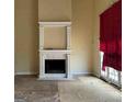 Living room highlighting fireplace, mantle, and natural light at 145 Windy Ridge Ct, Fayetteville, GA 30214