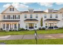 Inviting townhome showcases a well-manicured lawn and garden, enhancing its curb appeal at 1848 Eastmore Ave, Conyers, GA 30094