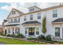 This townhome features black roof accents that beautifully complement the white siding at 1848 Eastmore Ave, Conyers, GA 30094