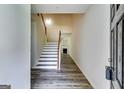 Inviting entryway with hardwood floors, staircase, and a view of the fireplace at 121 Wellbrook Circle Ne, Conyers, GA 30012