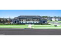 Beautiful community pool area with a covered pavilion, seating, and well-maintained landscaping at 8587 Secretariat Dr, Lithonia, GA 30058