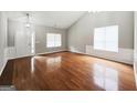 Bright and airy living room with hardwood floors, wainscoting, and vaulted ceiling at 537 Goldfinch Way, Stockbridge, GA 30281