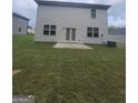A spacious backyard with a simple concrete patio, offering room for outdoor activities at 160 Grafton St, Hampton, GA 30228