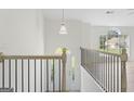 Bright and open foyer with modern lighting and a view to the home's exterior at 128 Southern Magnolia Ln, Rex, GA 30273