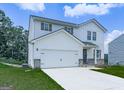 Beautiful two-story home with white siding, two-car garage, and well-maintained lawn at 520 Pemberton St, Euharlee, GA 30145