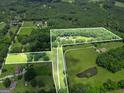 Aerial view of property outlining land, showcasing the lush greenery and surrounding landscape at 250 Friendship Church Rd, Brooks, GA 30205