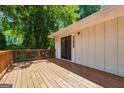 Spacious outdoor deck with wood railings and plenty of room for entertaining at 234 Kenilworth Cir, Stone Mountain, GA 30083
