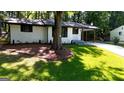 Charming renovated ranch with freshly landscaped lawn and covered entry at 5324 Joan Of Arc, Atlanta, GA 30349
