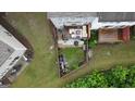 Aerial view of backyard featuring a cozy patio area with outdoor seating and lush greenery at 241 Balaban Cir # 241, Woodstock, GA 30188