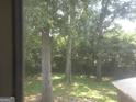 Backyard showcases towering trees, providing ample shade and a sense of natural beauty at 439 River Rd, Jonesboro, GA 30236