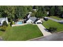 Spacious single-Gathering home featuring a fenced pool, covered patio, and a large manicured lawn at 401 N Lost Lake Cv, Villa Rica, GA 30180