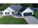 Single-Gathering home featuring a two car garage, and an inviting front porch perfect for entertaining at 401 N Lost Lake Cv, Villa Rica, GA 30180