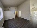 Spacious living room with neutral walls, laminate flooring, and open layout at 7560 Taylor Rd # 5, Riverdale, GA 30274