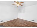 Bright bedroom with hardwood floors, a ceiling fan, and ample natural light at 840 Jett Rd, Jonesboro, GA 30236