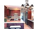 Traditional kitchen with tile countertops, stainless steel appliances, and ample cabinet space at 30 Cynthia Ct, Fayetteville, GA 30215