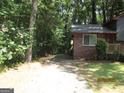 View of a long driveway leading to the home at 4350 Lincolndale Dr, Ellenwood, GA 30294