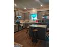 Modern kitchen featuring granite countertops, stainless steel appliances, and a central island with barstool seating at 1945 Labonte Pkwy # 42, Mcdonough, GA 30253