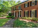 Inviting brick home with a covered entrance and well-maintained landscaping at 200 Savannah Walk, Peachtree City, GA 30269