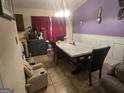 The dining room has an elegant marble table, decorative wall spoons, and natural light at 2071 Scarbrough, Stone Mountain, GA 30088