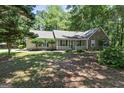 Charming single-story home featuring a stone facade, inviting front porch and nicely landscaped front yard at 380 Peach Drive, Mcdonough, GA 30253