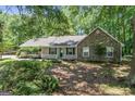 Charming single-story home featuring a stone facade, inviting front porch and nicely landscaped front yard at 380 Peach Drive, Mcdonough, GA 30253