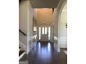 Welcoming foyer with hardwood floors, high ceilings, and white wainscoting throughout the entryway at 160 Elysian Dr, Fayetteville, GA 30214