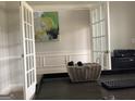 Stylish office space with French doors and a modern desk with decorative basket at 160 Elysian Dr, Fayetteville, GA 30214